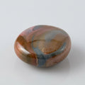 Polychrome jasper stone featuring natural swirls of earthy red, brown, cream and muted green, showcased in the J.W.H. Designs gemstone collection.