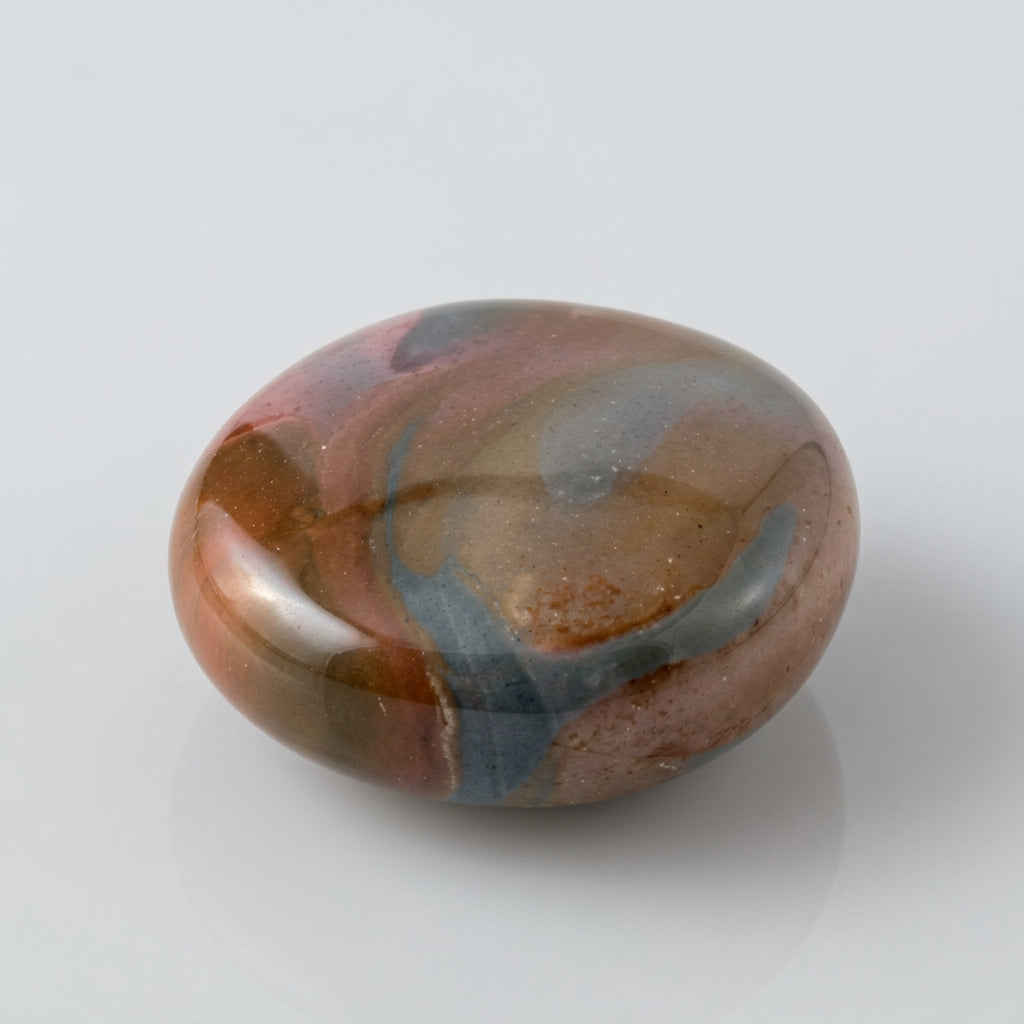 Polychrome jasper stone featuring natural swirls of earthy red, brown, cream and muted green, showcased in the J.W.H. Designs gemstone collection.