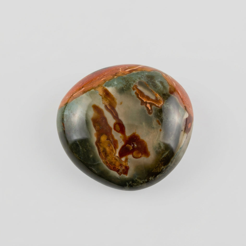 Polychrome jasper stone featuring natural swirls of earthy red, brown, cream and muted green, showcased in the J.W.H. Designs gemstone collection.