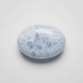 Blue calcite stone featuring soft sky-blue colouring and natural cloudy patterns, showcased in the J.W.H. Designs gemstone collection.