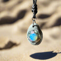01-PP-O-1 Beach Pebble with Opalite Cabochon and Fluorite Crystal Center