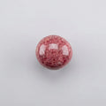 Rhodonite gemstone featuring distinctive pink and black patterns, showcased in the J.W.H. Designs gemstone collection.